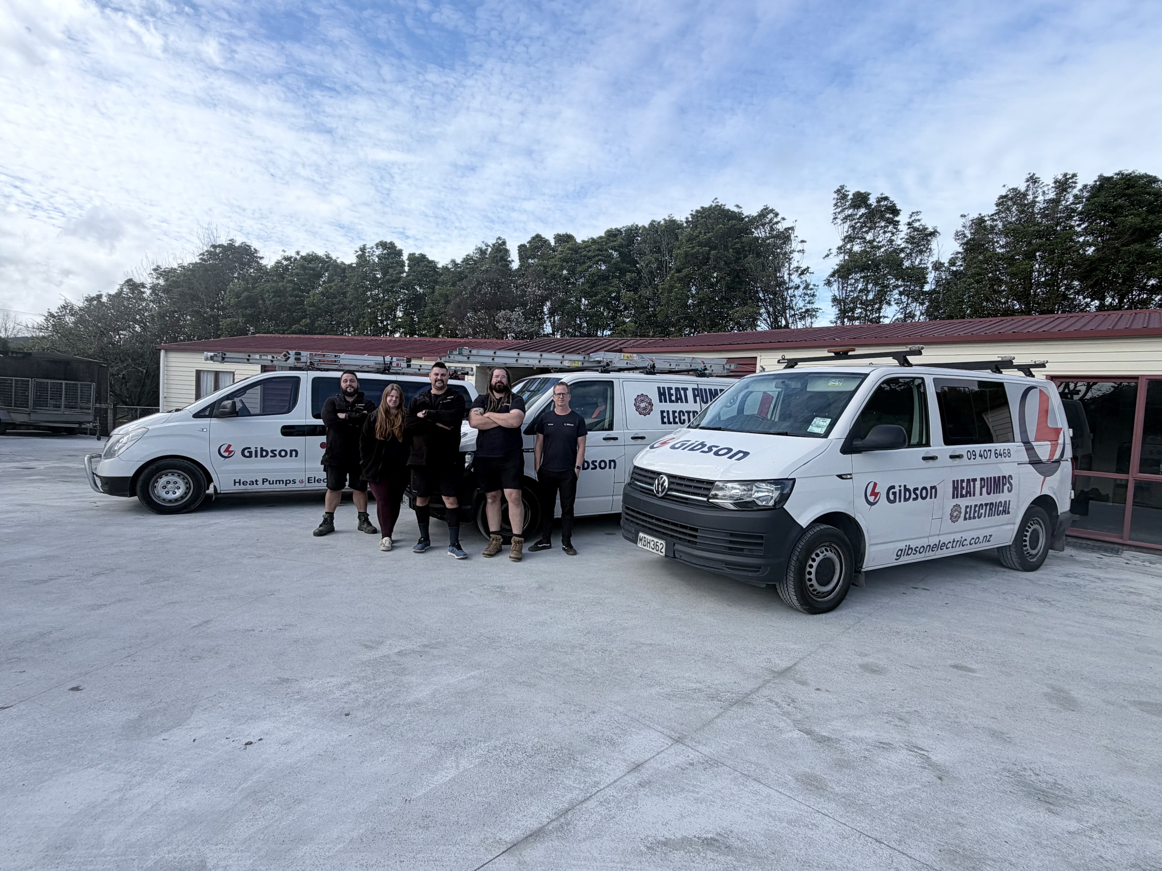 The Gibson Electric team with their vans in Northland